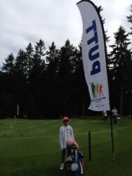 Little Alicia with her golf clubs