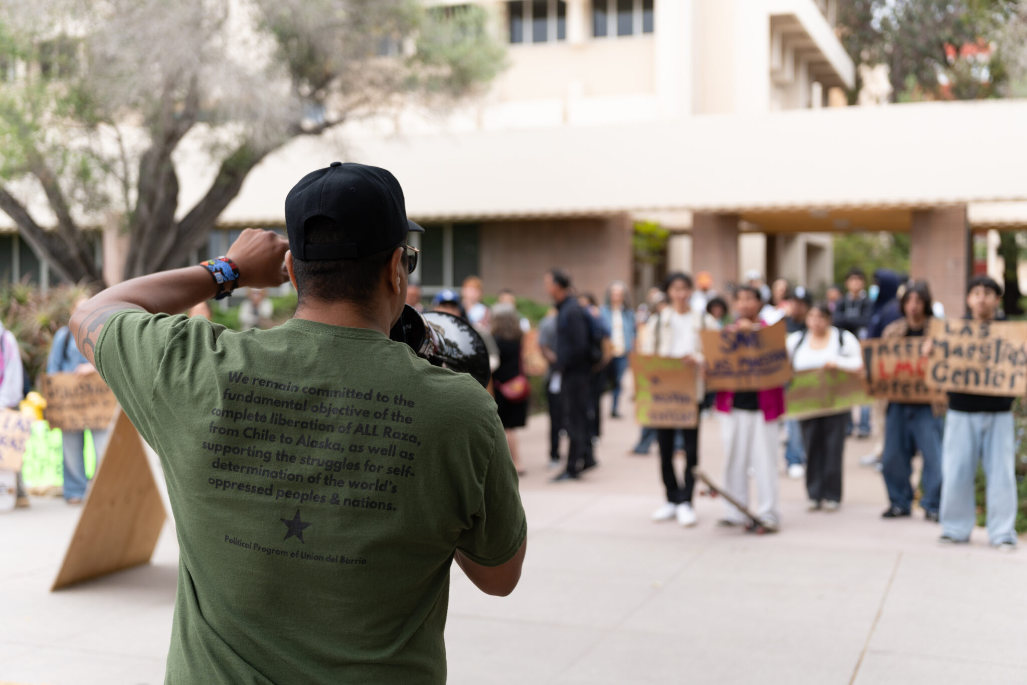 Once at Cheadle, protestors called on Assanis to come out, shouting “Dennis the menace,” and laid out signs on the ground facing the building with the words “Keep Las Maestras Center Open.” Shengyu Zhang / Daily Nexus