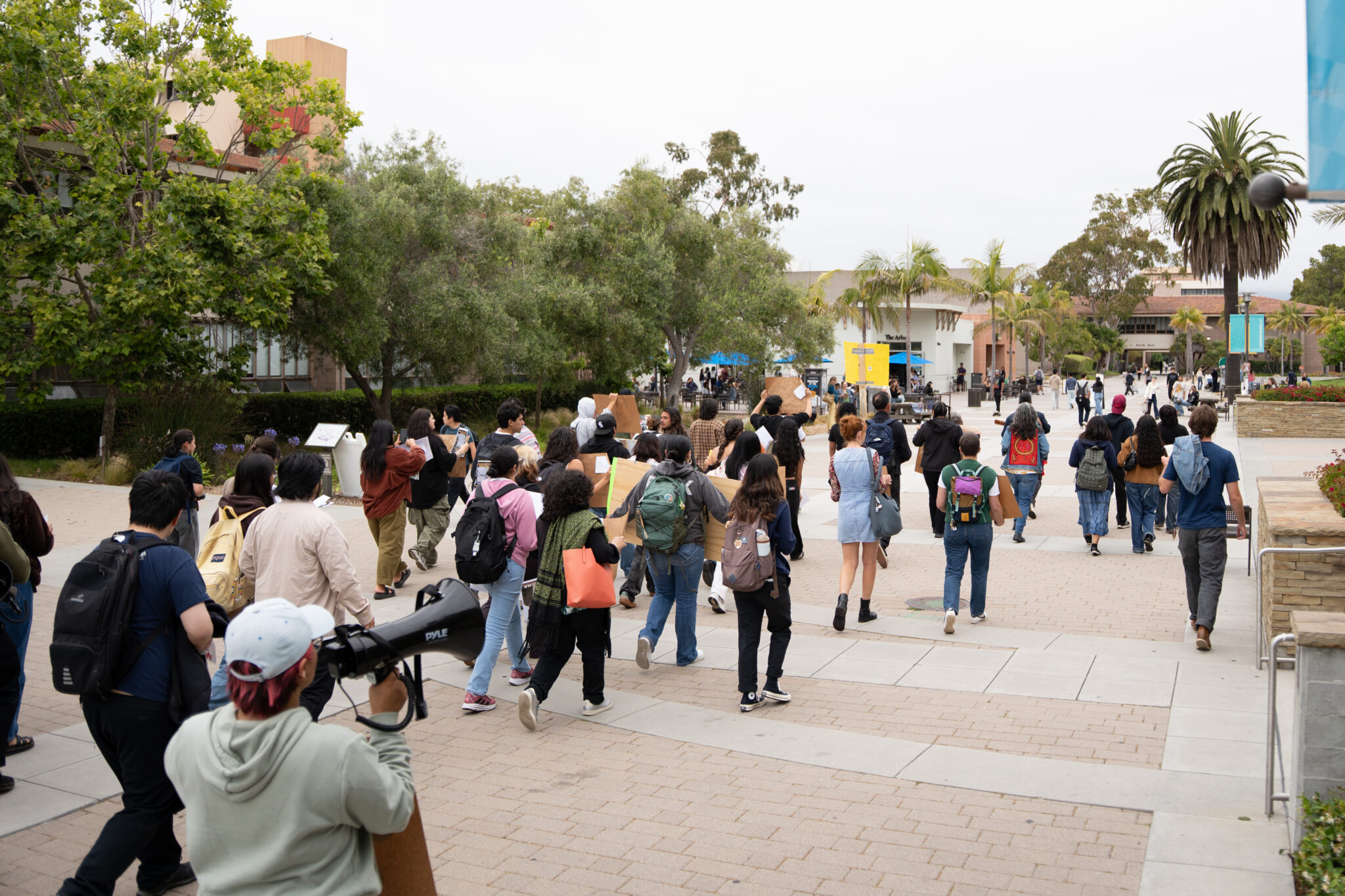 After exiting South Hall, protestors walked by the Arbor before arriving at Cheadle Hall, where Chancellor Dennis Assanis’ office is located. Shengyu Zhang / Daily Nexus
